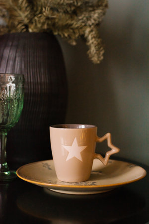 Close-up photo of a Christmas cup on a New Year's backgroundの写真素材