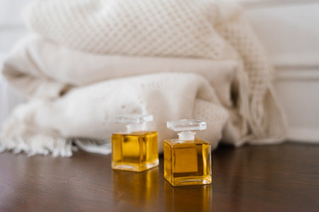 Two glass bottles with perfume or perfume in vintage style on the shelfの写真素材