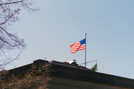 Seattle, USA. March 2022. Flag on the building in Hiram Chittenden Locks, or Ballard Lacks, a complex of looks at the west end of Salmon Bayのeditorial素材