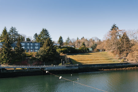 Seattle, USA. March 2022. View of the Hiram Chittenden Locks, or Ballard Lacks, a complex of looks at the west end of Salmon Bay. Washington's Lake Washington Ship Canal promenadeのeditorial素材