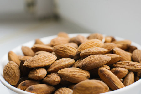 Close-up almonds on a plateの写真素材