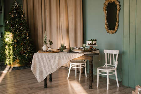 Beautifully decorated and served dining christmas table in the living room in a Scandinavian-style...