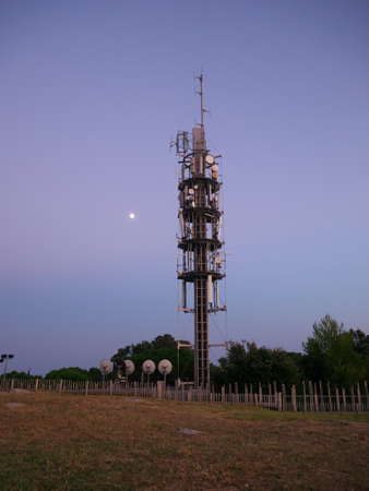 Photo of a relay antenna taken during duskの写真素材