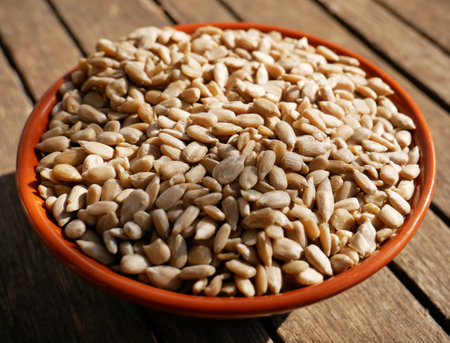 A closeup shot of sunflower seeds in a bowlの写真素材
