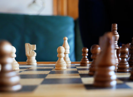 A closeup shot of a chessboard with the focus on a white's pawnの写真素材