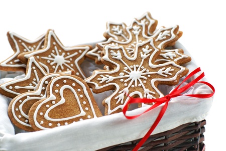 Gingerbread cookies decorated with royal icing arranged in a basket              