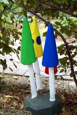 carved sculptures of mushroom in a gardenの写真素材