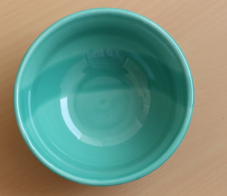 Bowl on brown boardの写真素材