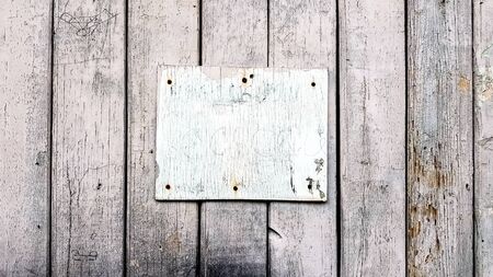 Sign boards on a rustic wooden wall mockup. vintage frames on an old wooden wall. Gray wooden...