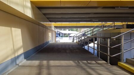 light rail station. Design of a bus stop and a pedestrian underpass with steps and railings made of...