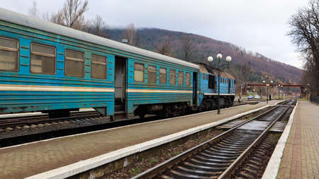 Ukraine, Yaremche - November 20, 2019: train at the station on a background of mountains. Unique...