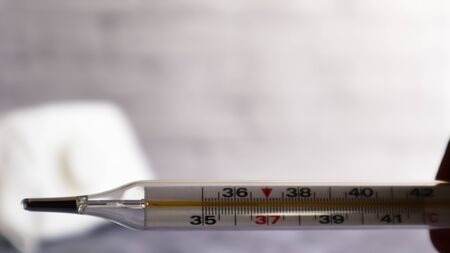 Coronavirus medical mask and thermometer for measuring temperature. respiratory bandage for the...