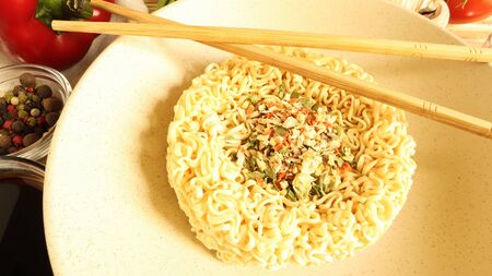 Instant noodles with king mushrooms, seasonings, soy sauce, peppers, green onions, tomatoes....
