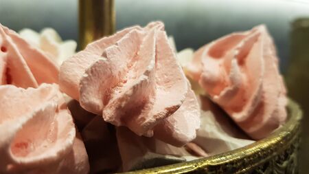 Color sweet homemade meringues and marshmallows. Airy and tender pastry marshmallows dessert. The sweet dish you want to eat. Sweets in the darkの写真素材