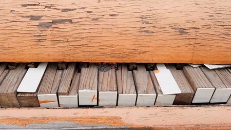 Closeup of a broken piano keyboard of an old pianoの写真素材