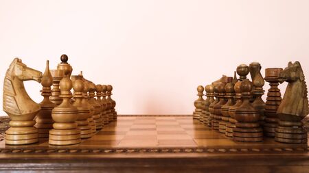 wooden chessboard with wooden brown chess piecesの写真素材
