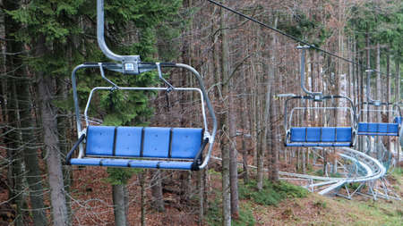 Ukraine, Bukovel - November 20, 2019. Autumn view of the ski resort with a chairlift against the...