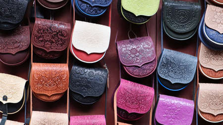 Souvenir market in Yaremche. Women's colored leather shoulder bags embossed with a Carpathian...