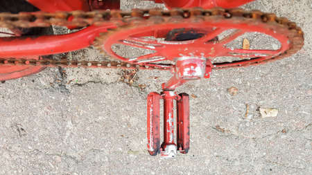 Retro vintage red bike close up. An old charming concept of a classic abandoned bike
