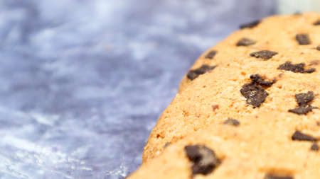 Soft, freshly baked chocolate chip cookies on a gray marble kitchen countertop. American traditional sweet pastry pastry, delicious homemade dessert. Culinary background. Copy space.の写真素材