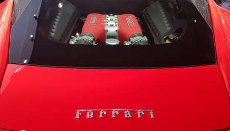 A red Ferrari engine is parked in TNP's car, Rama 9 Road. A close-up of the glass cover of a Ferrari...