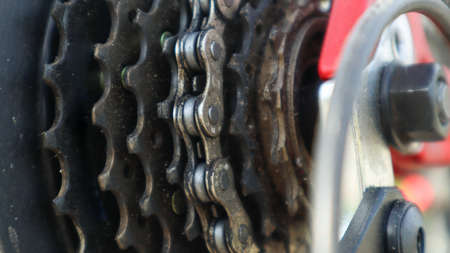 Close-up of a rear set of gear shifting sprockets on the rear wheel of a modern mountain bike with...