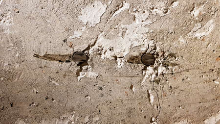 Reinforced concrete wall is useful as a background. Reinforced concrete with damaged metal fittings.の写真素材