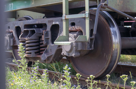 The undercarriage of the carriage with wheels and springs. Passenger train, freight train. Industrial railway wheels close upの写真素材