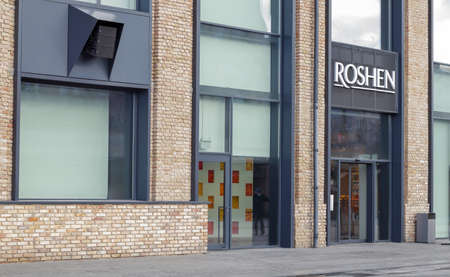 Confectionery chocolate factory Roshen in Kiev. Emblem of the Roshen company. Business owned by former President of Ukraine Petro Poroshenko. Roshen Corp. Ukraine, Kiev - February 09, 2022のeditorial素材