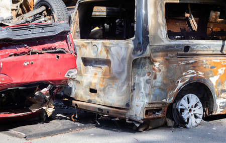Auto in Irpen. Kyiv region, Ukraine. Russia Ukraine war. Cemetery of cars in Irpin, the consequences of the invasion of the Russian army in Ukraine. Destroyed cars of the civilianの写真素材