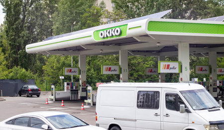 A network of gas stations in Ukraine with an OKKO store and cafe. Filling station, retail trade in petroleum products. Ukraine, Kyiv - May 23, 2022のeditorial素材