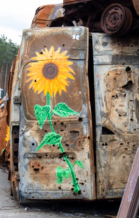 A burnt and shelled car, the consequences of the invasion of Ukraine. War in Ukraine. Cemetery of destroyed cars of civilians who tried to evacuate. Ukraine, Irpin - May 06, 2023のeditorial素材