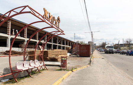 Abandoned ruined shopping center in the suburbs of the Ukrainian capital. Translation Giraffe. Destroyed, blown up and burnt civilian object after the bombing. Ukraine, Irpin - April 29, 2023.のeditorial素材