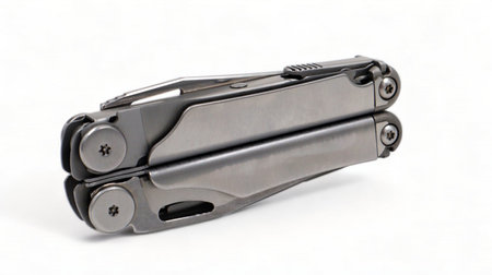 Folded steel multitool isolated on white background. A tool for daily practice. All in one....
