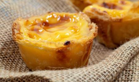 Lots of freshly baked desserts Pastel de nata or Portuguese egg tart. Pastel de Belm is a small pie...