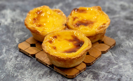 Lots of freshly baked desserts Pastel de nata or Portuguese egg tart. Pastel de Belm is a small pie...