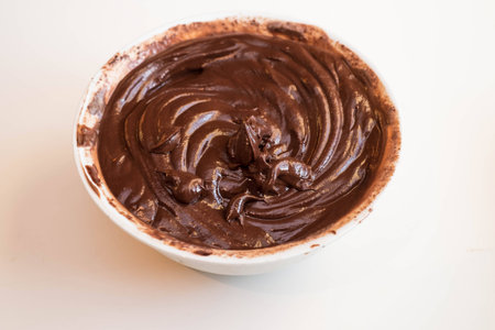Home made chocolate ganache in a white bowl to make trufflesの写真素材