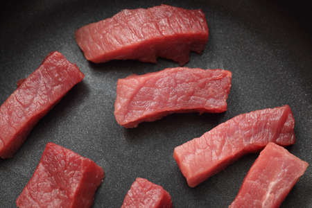 Beef steaks in a frying pan. Close-up.の写真素材