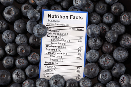 Nutrition facts of blueberries with blueberries の写真素材