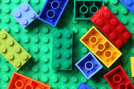 Tambov, Russian Federation - June 22, 2012  LEGO Blocks on a green baseplate.Lego (trademarked in capitals as LEGO) is a popular line of construction toys manufactured by the Lego Group, a privately held company based in Billund, Denmark.のeditorial素材