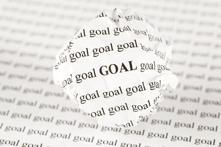 Crumpled paper ball with words "goal"の写真素材