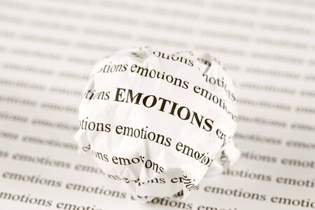 Crumpled paper ball with words "emotions"の写真素材