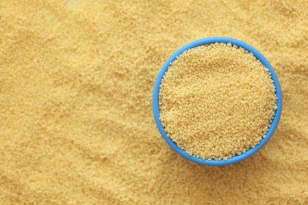 Couscous in a blue bowl on couscous . Close-up.の写真素材