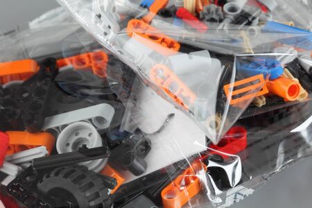 New constructor\'s parts in plastic packs on the grey .の写真素材