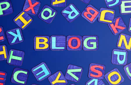Word \"Blog\" spell out on blue with letters. Letters drawn by me.の写真素材