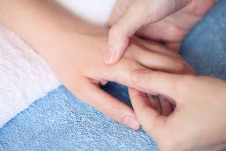 Woman getting a hand massage.の写真素材