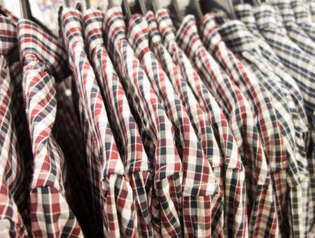 Plaid shirts on shoulders in the storeの写真素材