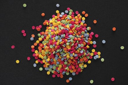 Multicolor sprinkles on black backgroundの写真素材