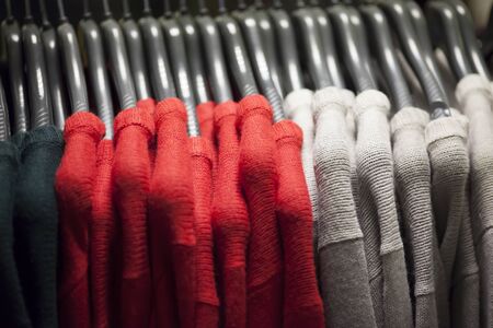 Sweaters on shoulders in the storeの写真素材