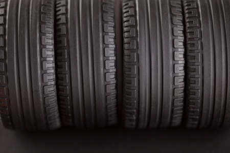 Four tires on black background.の写真素材